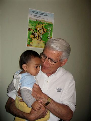 St-Joseph-Church-Sister-Parish-Fr-Manny-with-child