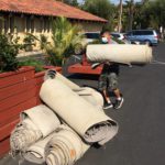 Old carpet being removed