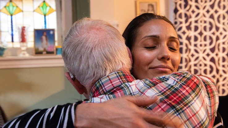 Woman helping an elderly man