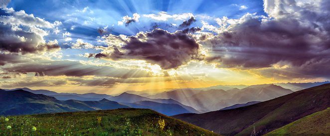 Sunlight Explosion Behind Dark Clouds Over Green Hills by Scopio from NounProject.com