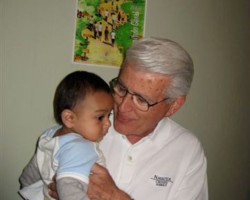 St-Joseph-Church-Sister-Parish-Fr-Manny-with-child